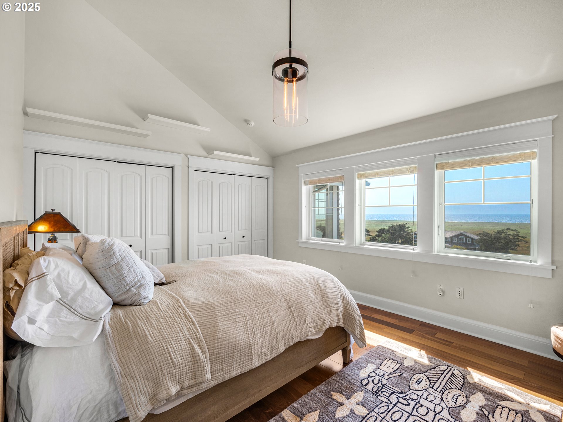 89062 Pinehurst Road Gearhart, OR 97138 - Photo 27 of 42 a bedroom with a bed and a window