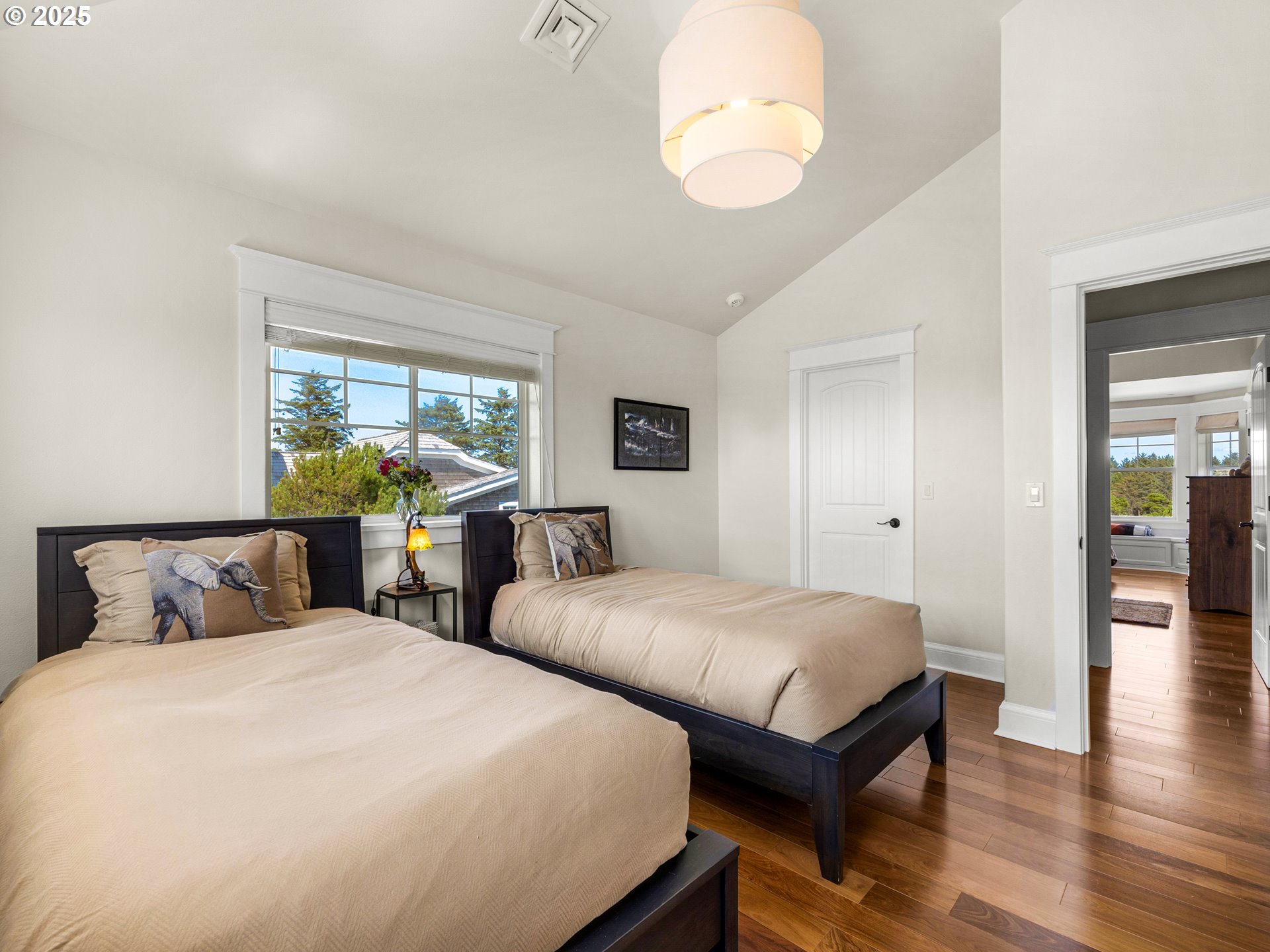 89062 Pinehurst Road Gearhart, OR 97138 - Photo 29 of 42 a bedroom with two beds and a large window