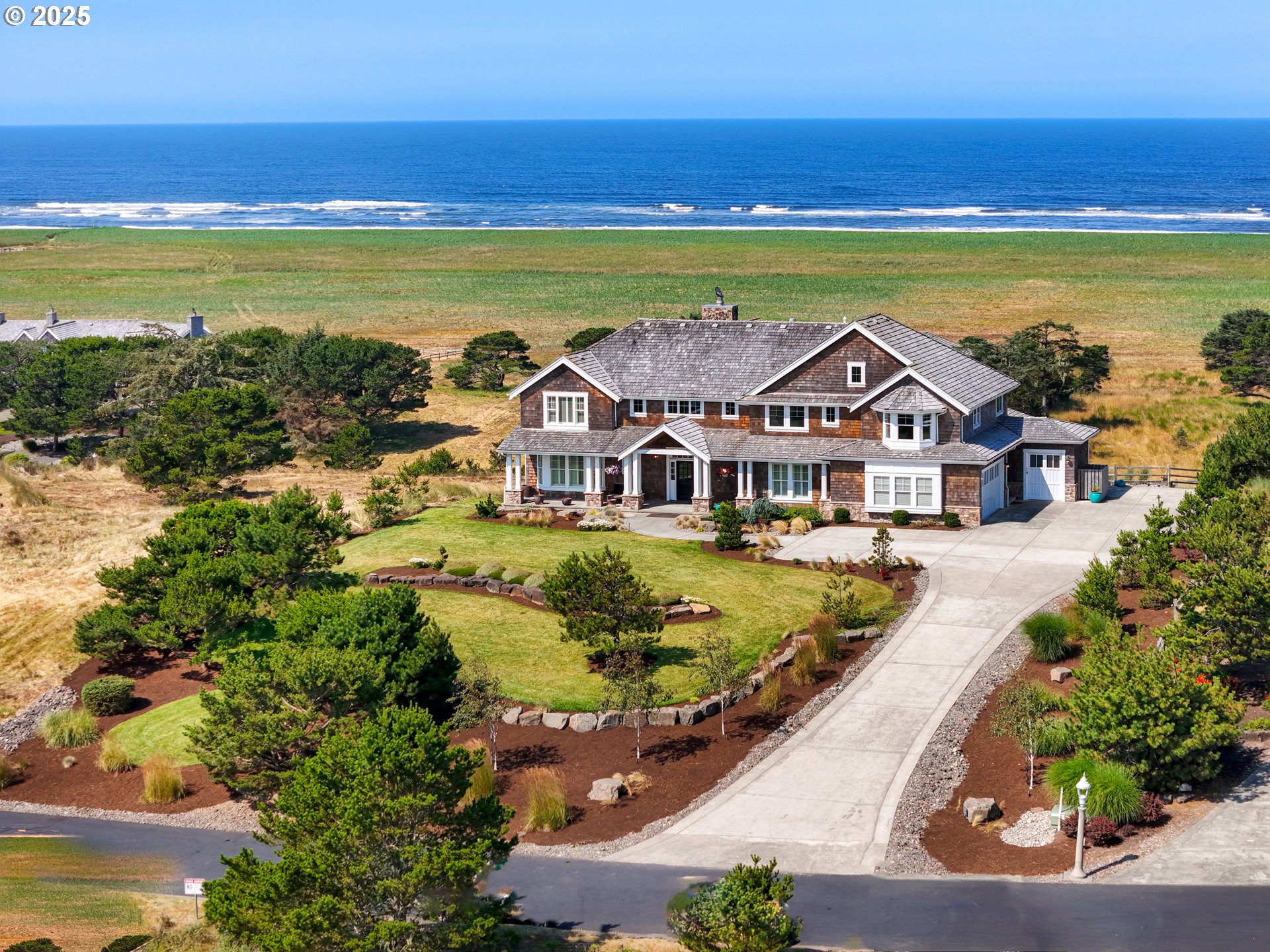89062 Pinehurst Road Gearhart, OR 97138 - Photo 3 of 42 a view of a city with an ocean view