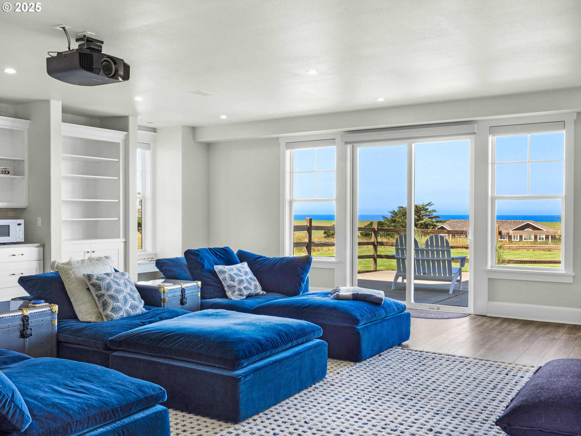 89062 Pinehurst Road Gearhart, OR 97138 - Photo 34 of 42 a living room with furniture and a floor to ceiling window