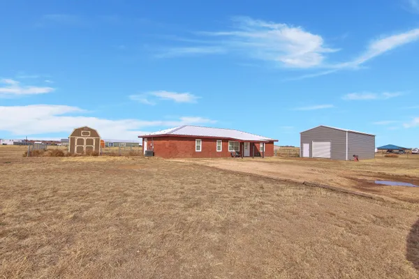 a large body of water with a building in the background