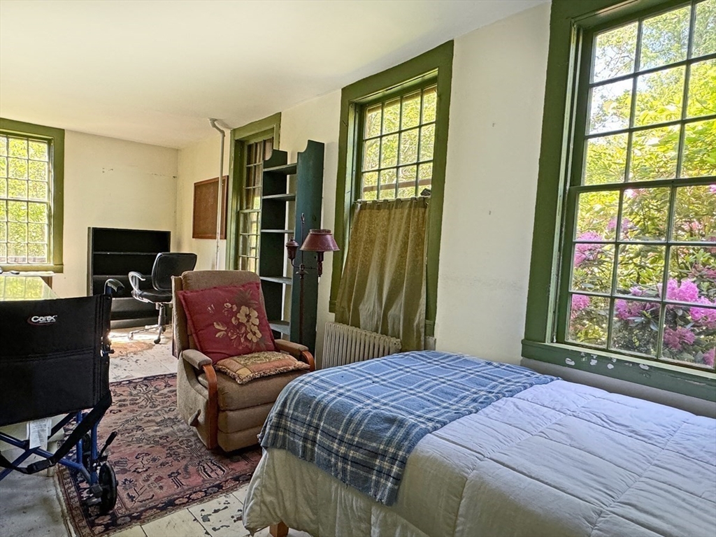 89 Wanamaker Road Northfield, MA 01360 - Photo 13 of 42 a bedroom with a bed and wooden floor