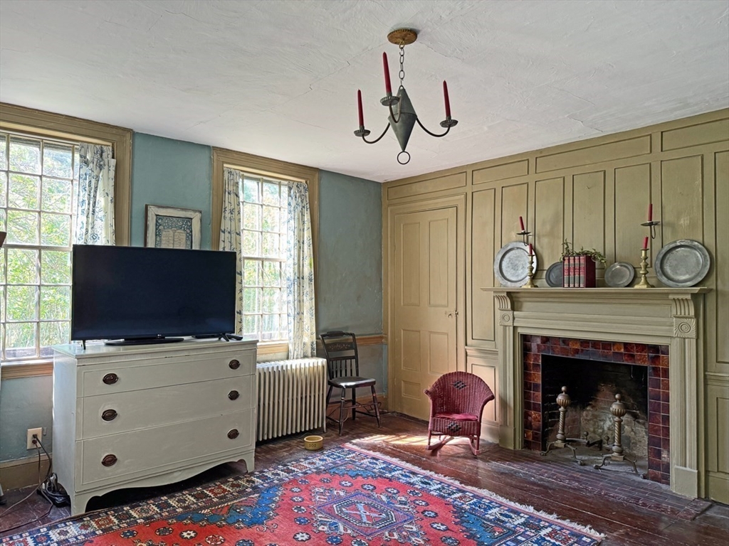 89 Wanamaker Road Northfield, MA 01360 - Photo 16 of 42 a living room with furniture and a fireplace