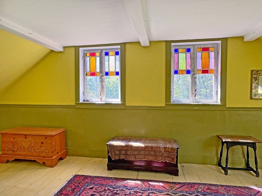 89 Wanamaker Road Northfield, MA 01360 - Photo 19 of 42 a living room with furniture and a baby crib