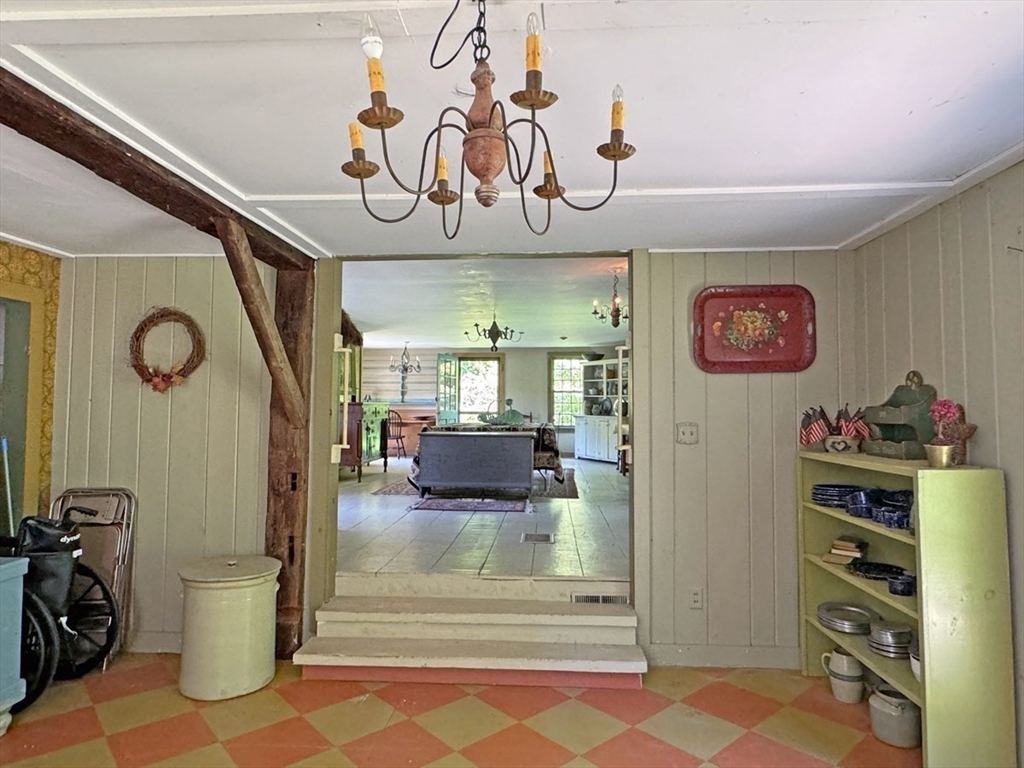 89 Wanamaker Road Northfield, MA 01360 - Photo 26 of 42 a view of a hallway with cabinet and a chandelier