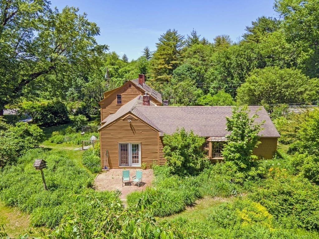 89 Wanamaker Road Northfield, MA 01360 - Photo 30 of 42 a front view of a house with a yard and trees