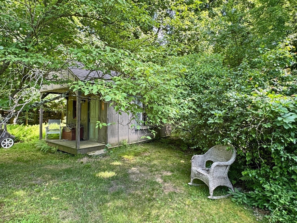 89 Wanamaker Road Northfield, MA 01360 - Photo 35 of 42 a view of a backyard with table and chairs and a tree