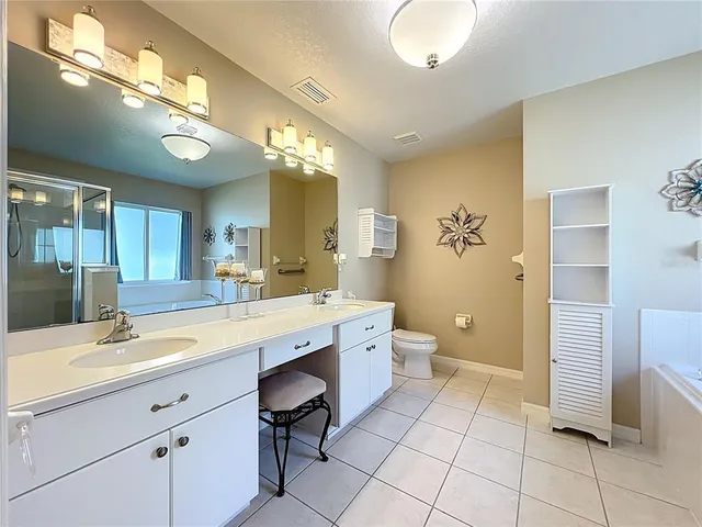 a view of storage and utility room with washer and dryer
