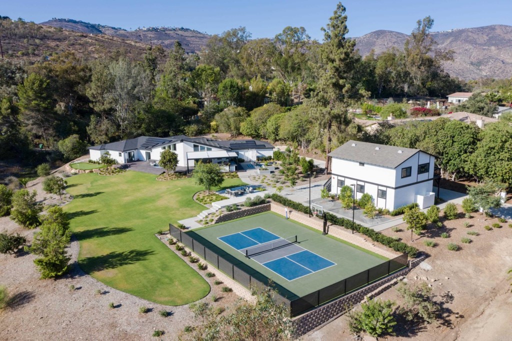 an aerial view of a house with a garden