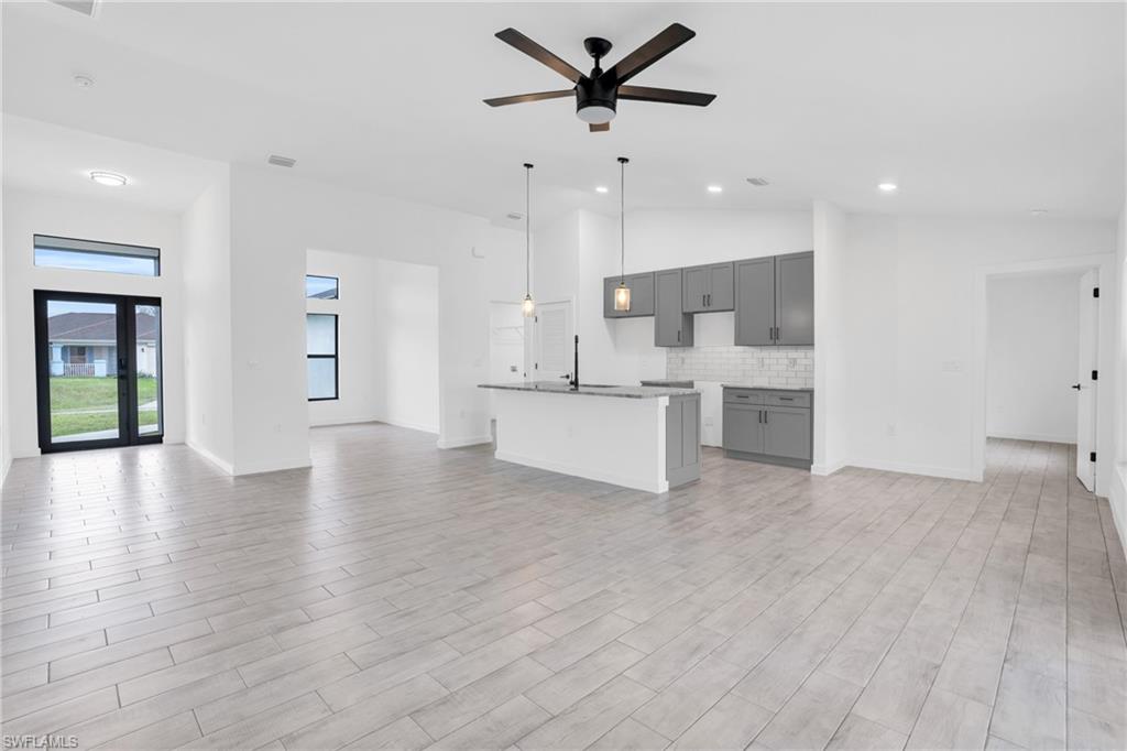 a view of a kitchen with a sink and a window