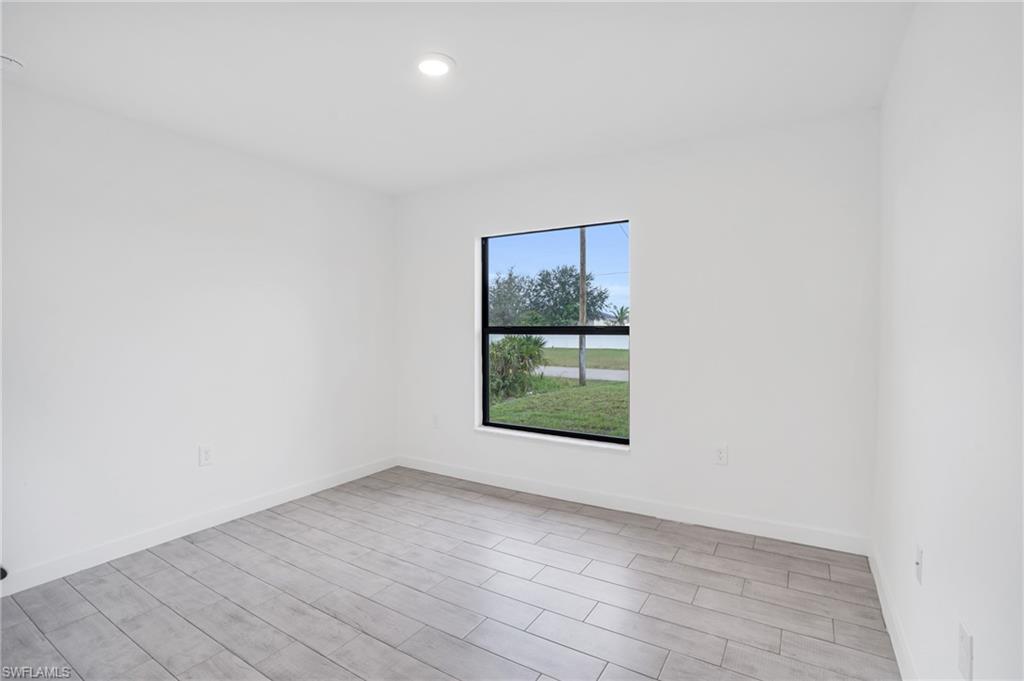 2719 29th Street Southwest Lehigh Acres, FL 33976 - Photo 11 of 23 an empty room with window