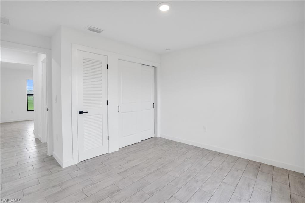 2719 29th Street Southwest Lehigh Acres, FL 33976 - Photo 12 of 23 a view of an empty room