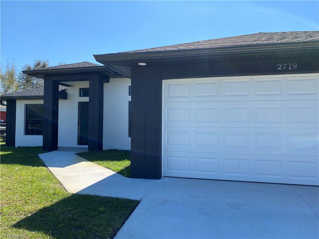 2719 29th Street Southwest Lehigh Acres, FL 33976 - Photo 23 of 23 a view of an entrance of the house