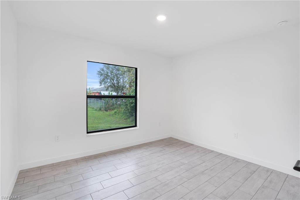 2719 29th Street Southwest Lehigh Acres, FL 33976 - Photo 9 of 23 an empty room with a window