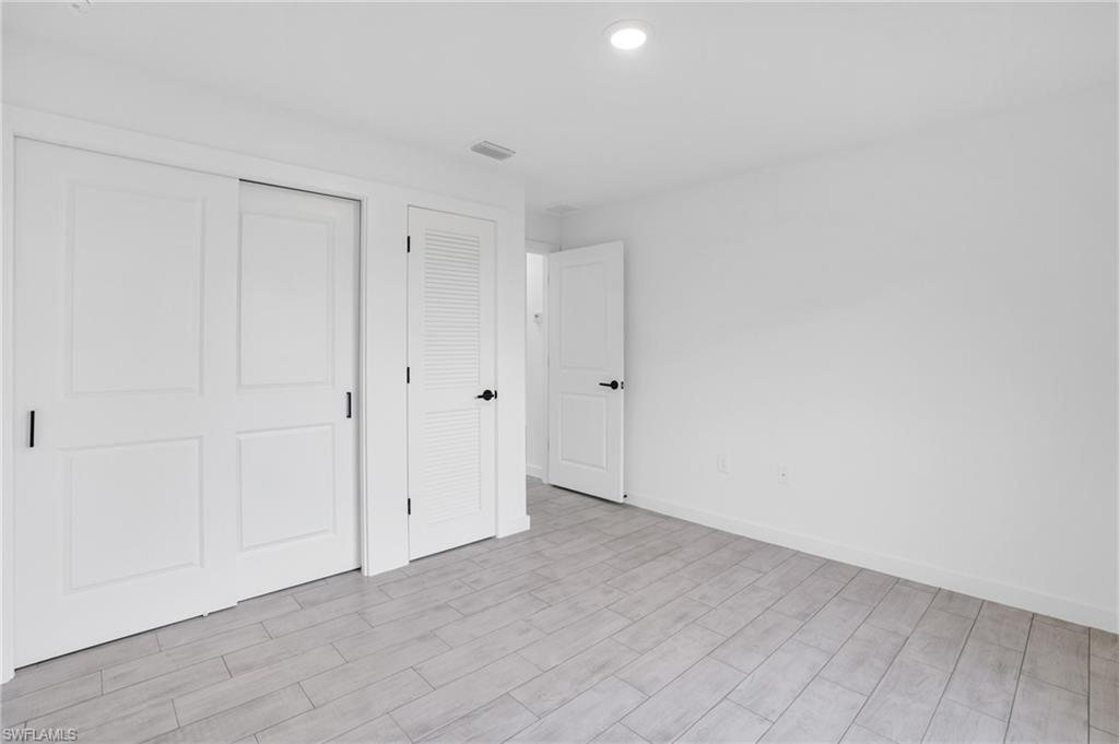2719 29th Street Southwest Lehigh Acres, FL 33976 - Photo 10 of 23 a view of an empty room
