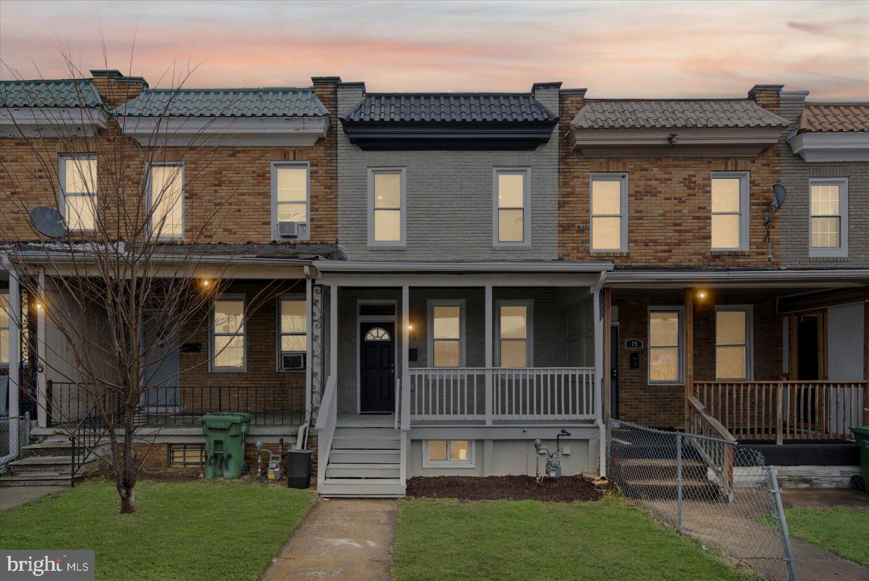 a view of a brick house with a large windows