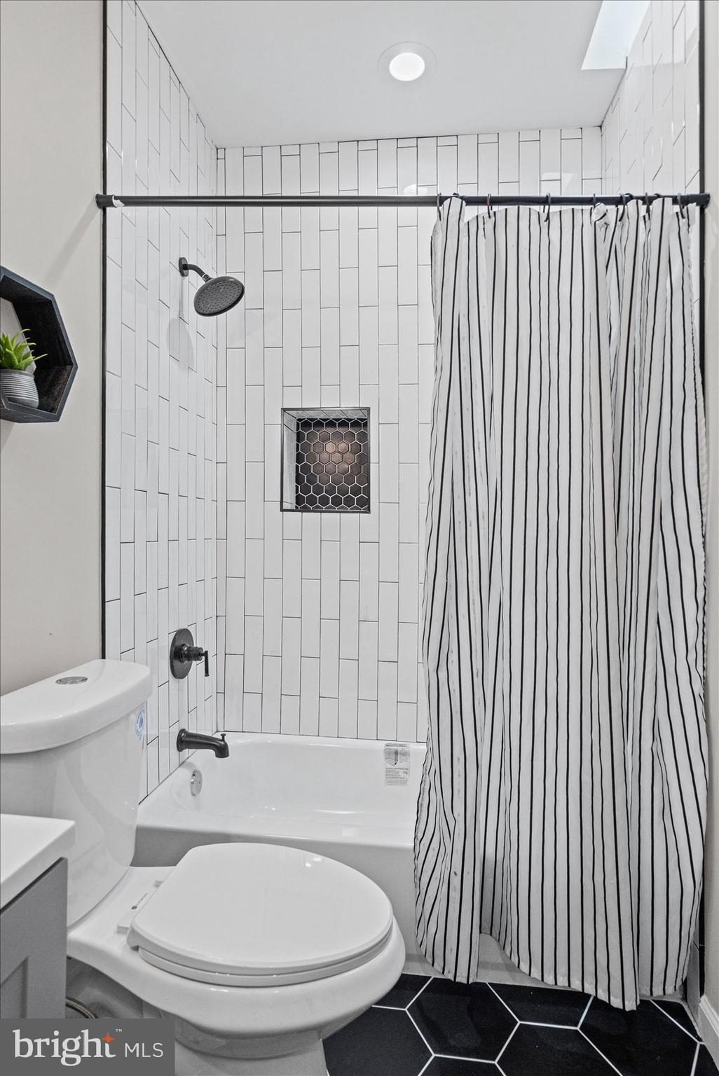 13 South Hilton Street Baltimore, MD 21229 - Photo 29 of 48 a bathroom with a sink and a mirror