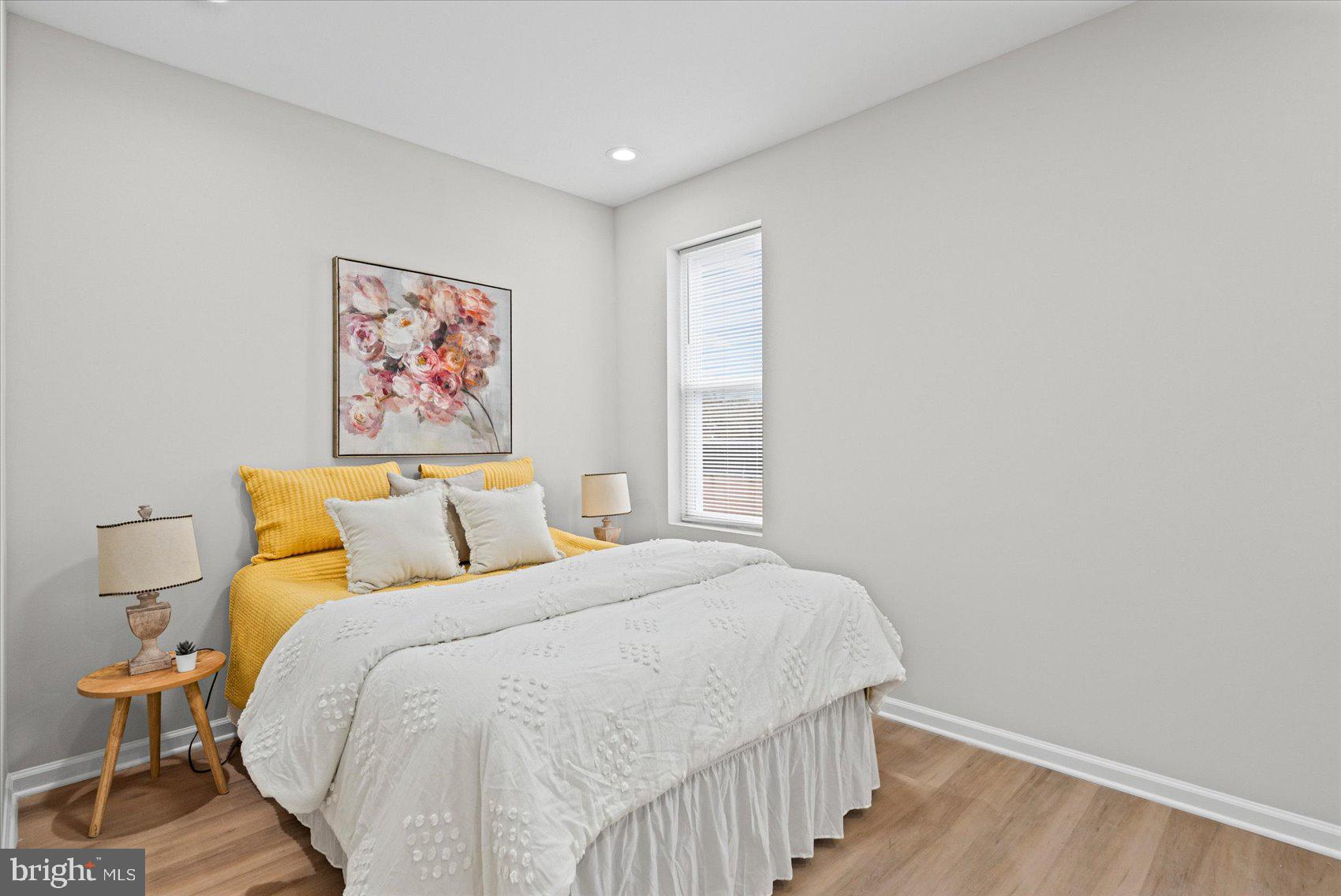 13 South Hilton Street Baltimore, MD 21229 - Photo 33 of 48 a bedroom with a bed and a painting on the wall