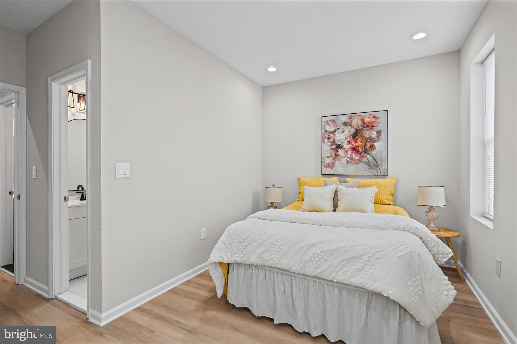 13 South Hilton Street Baltimore, MD 21229 - Photo 34 of 48 a bedroom with a bed and painting on the wall