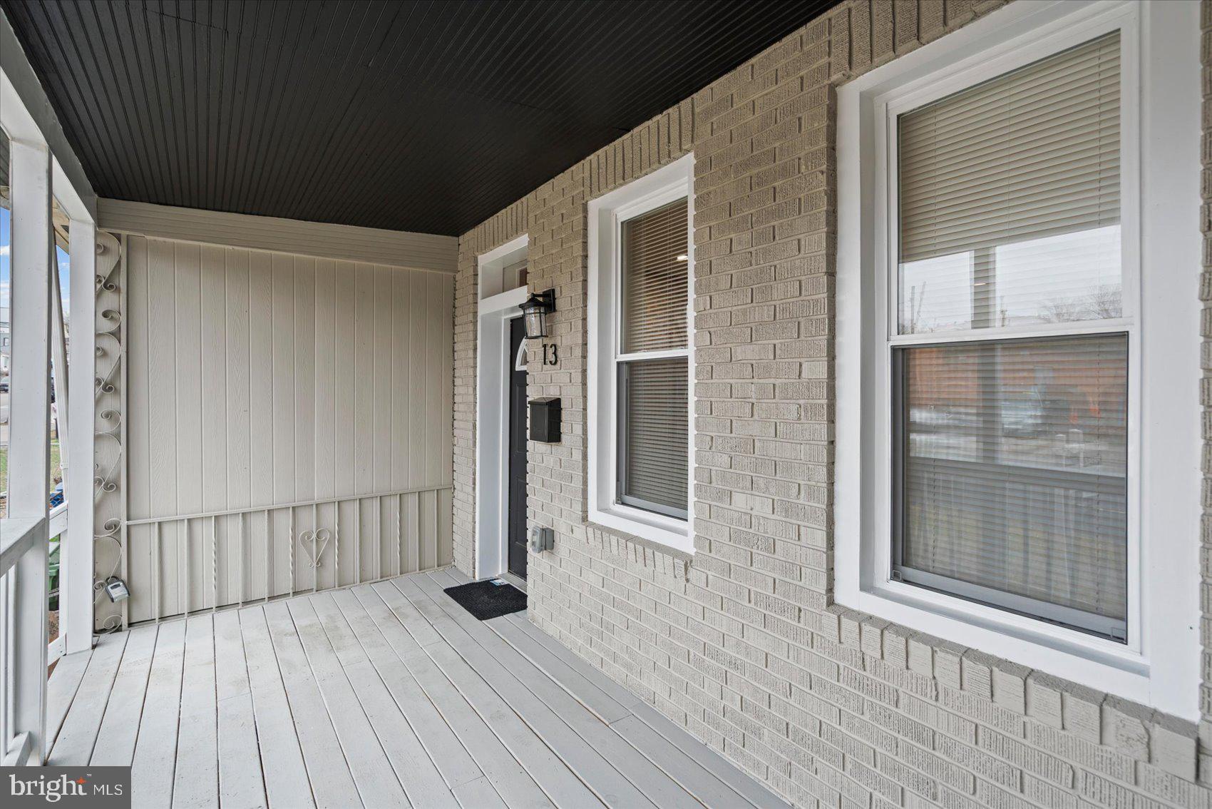 13 South Hilton Street Baltimore, MD 21229 - Photo 42 of 48 a view of outdoor space with wooden floor and windows