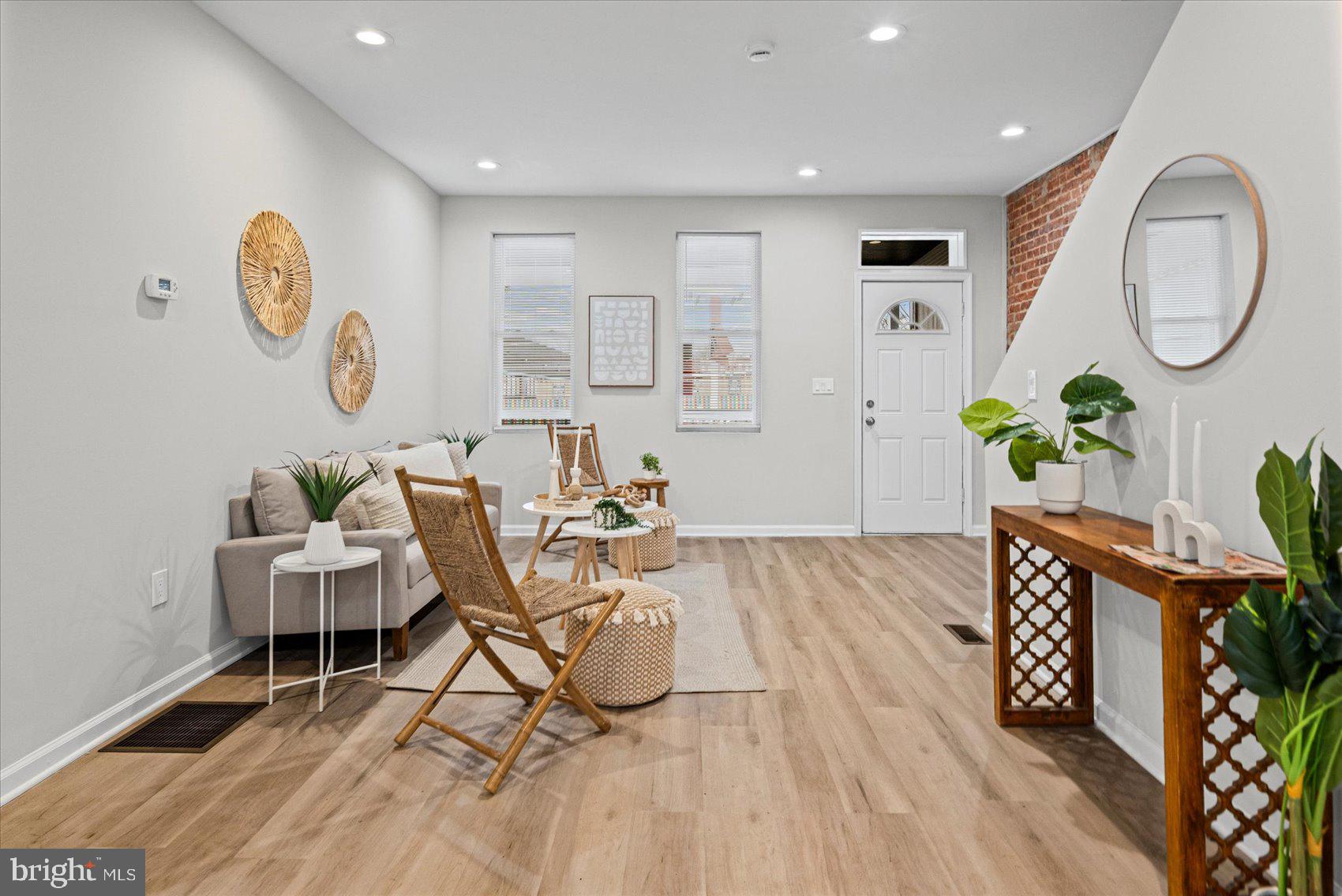 13 South Hilton Street Baltimore, MD 21229 - Photo 7 of 48 a living room with dining room and wooden floor
