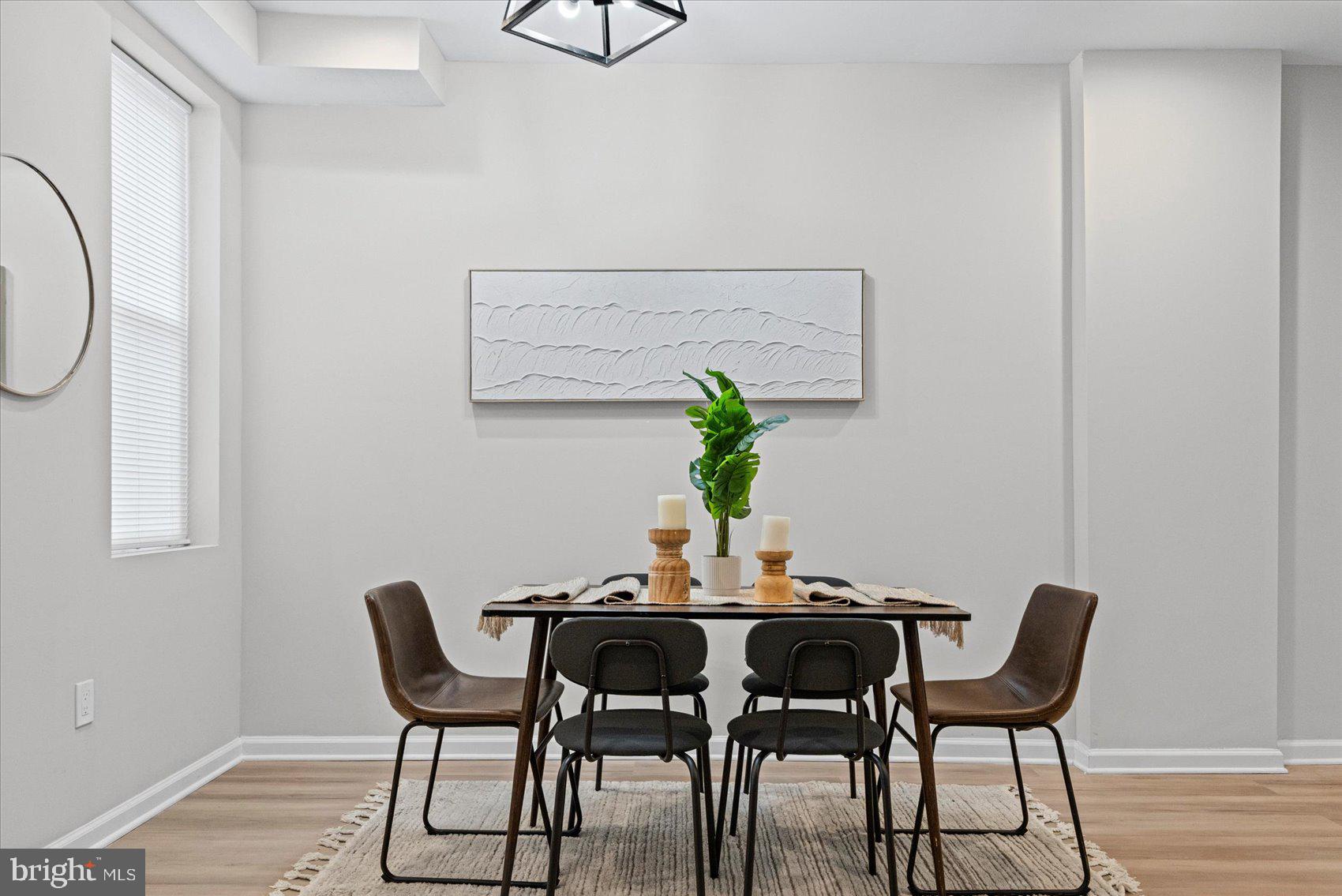 13 South Hilton Street Baltimore, MD 21229 - Photo 8 of 48 a dining room with furniture and wooden floor