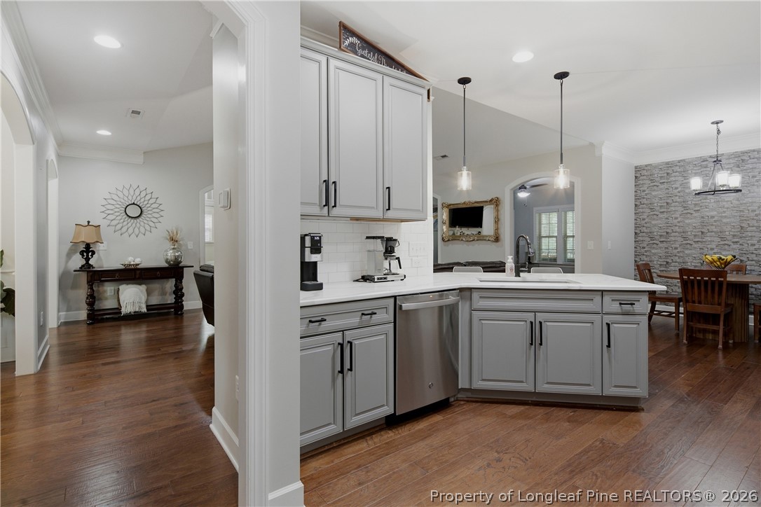 148 Heatherspring Way Spring Lake, NC 28390 - Photo 23 of 50 a kitchen with sink cabinets and wooden floor