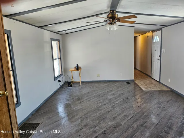 a kitchen with stainless steel appliances kitchen island granite countertop a sink stove and refrigerator