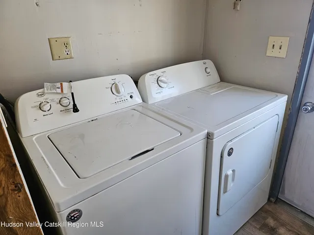 a bathroom with a toilet and a tub