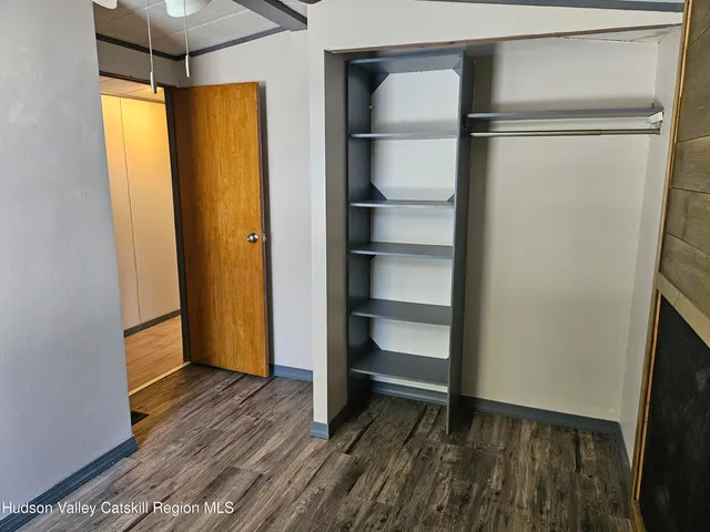 a view of backyard with seating space and trees