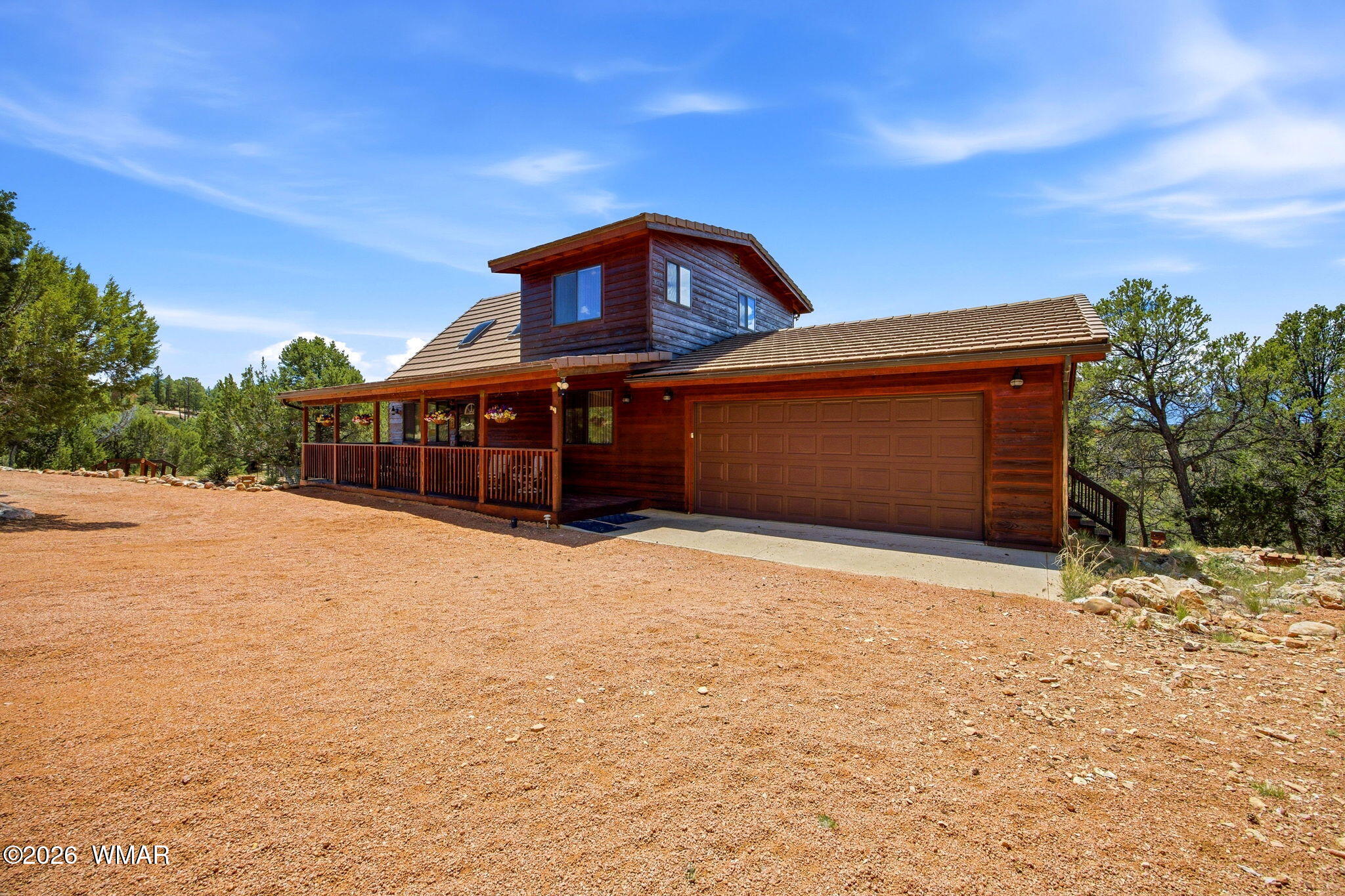2806 Sky Hawk Drive Overgaard, AZ 85933 - Photo 5 of 43 a front view of a house with a yard