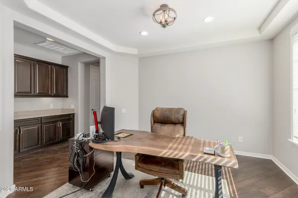a workspace with furniture hardwood and a window