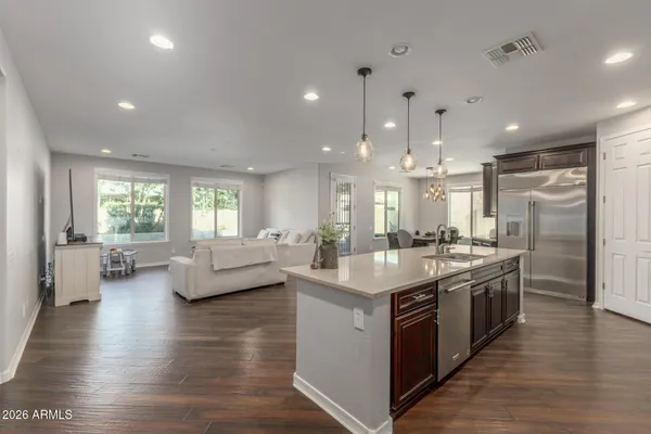 a view of a dining room with furniture and wooden floor