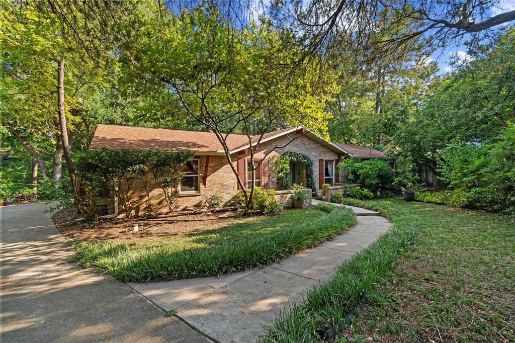702 Keywe Place Duncanville, TX 75116 - Photo 1 of 40 a front view of a house with garden