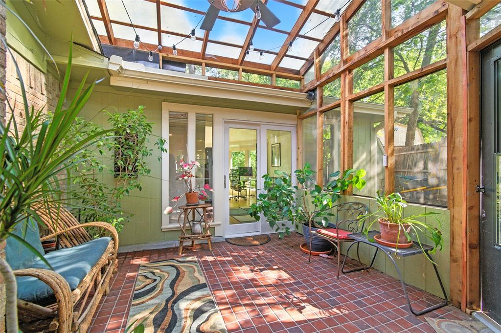 702 Keywe Place Duncanville, TX 75116 - Photo 13 of 40 a view of a porch with furniture and floor to ceiling window