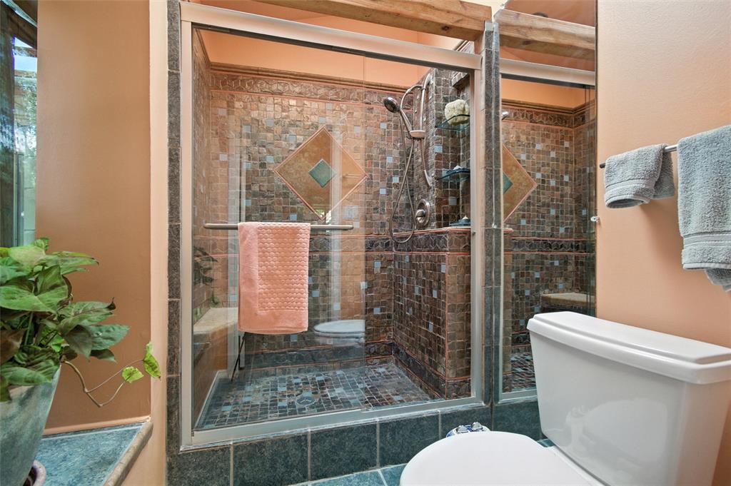 702 Keywe Place Duncanville, TX 75116 - Photo 24 of 40 a bathroom with a toilet and a shower