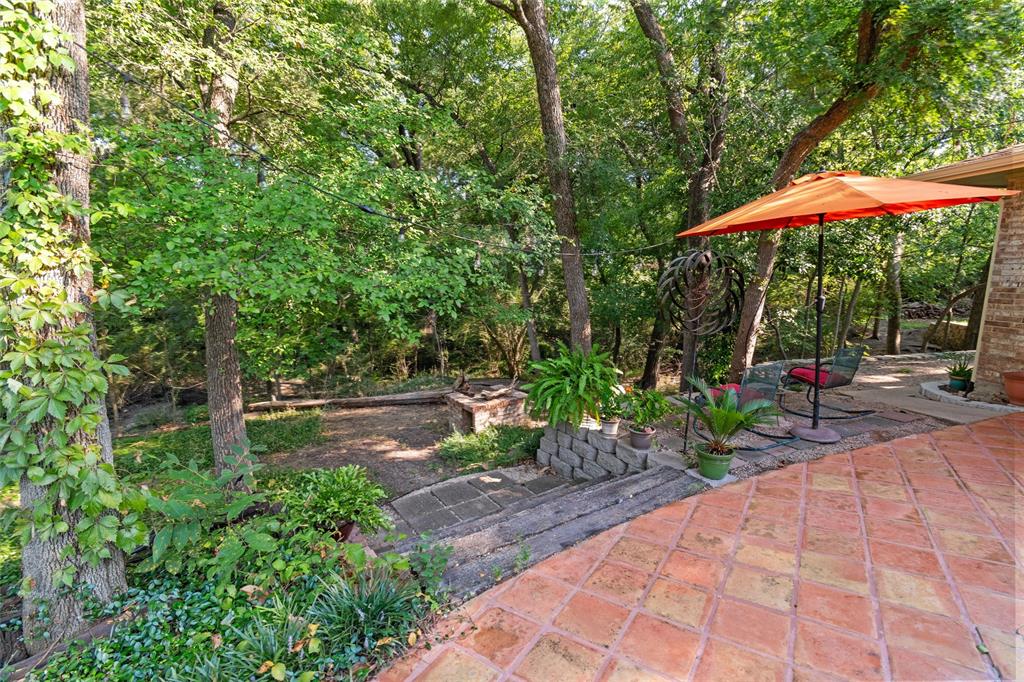 702 Keywe Place Duncanville, TX 75116 - Photo 30 of 40 a view of a backyard with a patio and plants