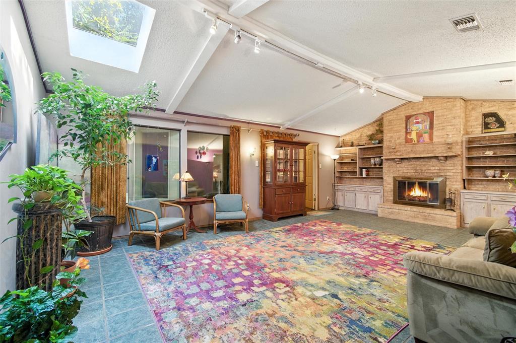 702 Keywe Place Duncanville, TX 75116 - Photo 3 of 40 a living room with furniture and a fireplace
