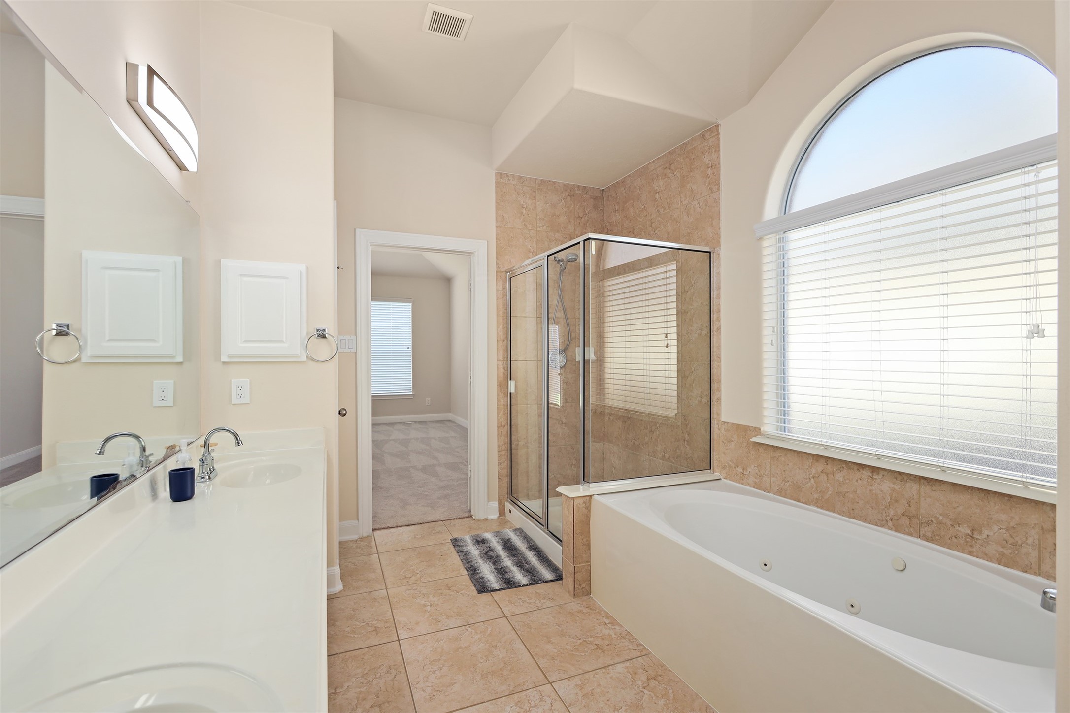 5026 Gulf Stream Lane Bacliff, TX 77518 - Photo 12 of 20 a bathroom with a bathtub and shower