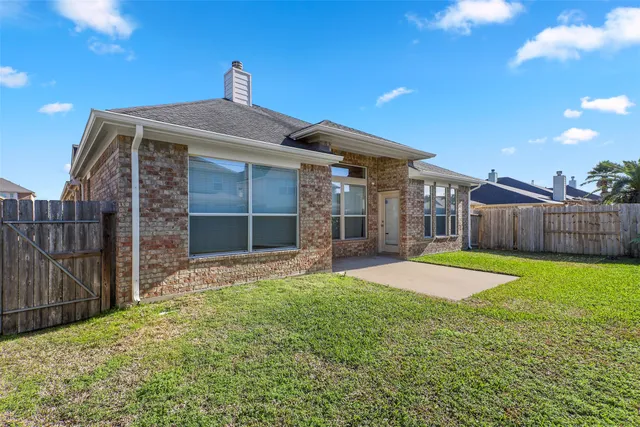 a front view of a house with yard and garage