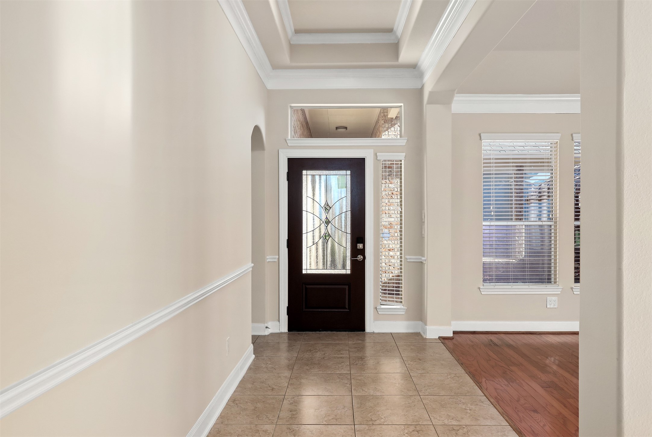 5026 Gulf Stream Lane Bacliff, TX 77518 - Photo 6 of 20 a view of a hallway to an empty room with wooden floor and a window