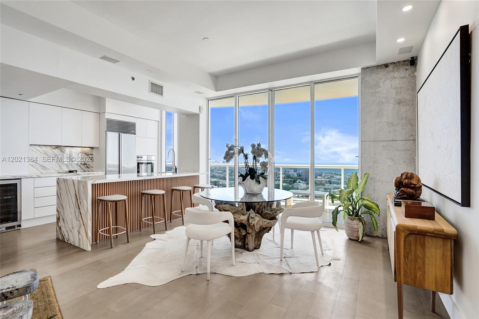 400 Alton Road, Unit PH11 Miami Beach, FL 33139 - Photo 3 of 49 a living room with fireplace furniture and a large window