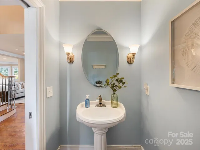 a bathroom with a sink and mirror