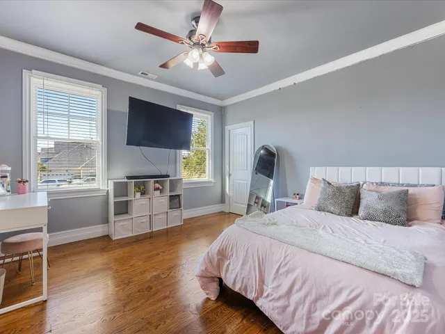 a bedroom with a large bed and a window