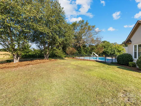 a view of swimming pool with an outdoor space and seating area