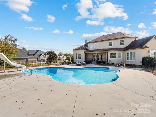 a view of a house with swimming pool