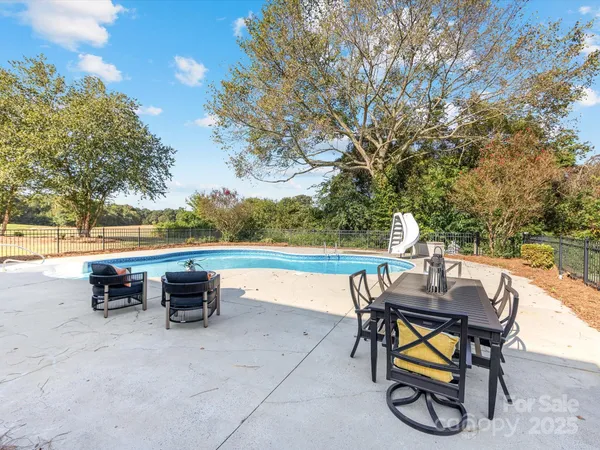 a view of chairs and table in the terrace