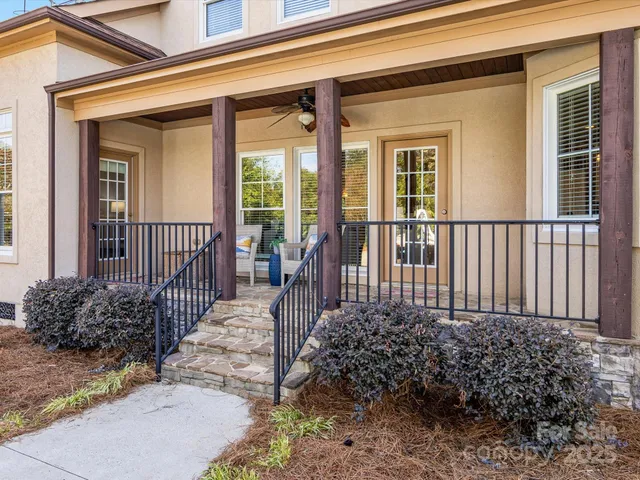 a view of a house with porch and wooden floor