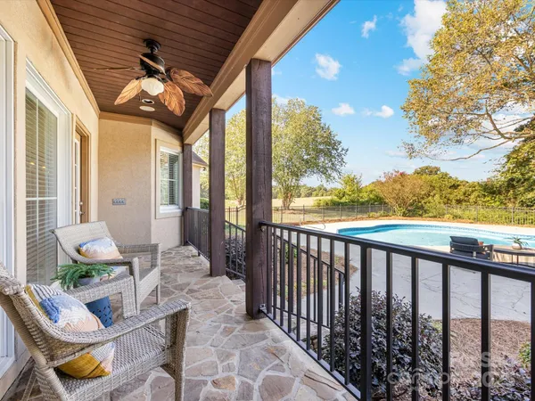 an aerial view of a house with yard