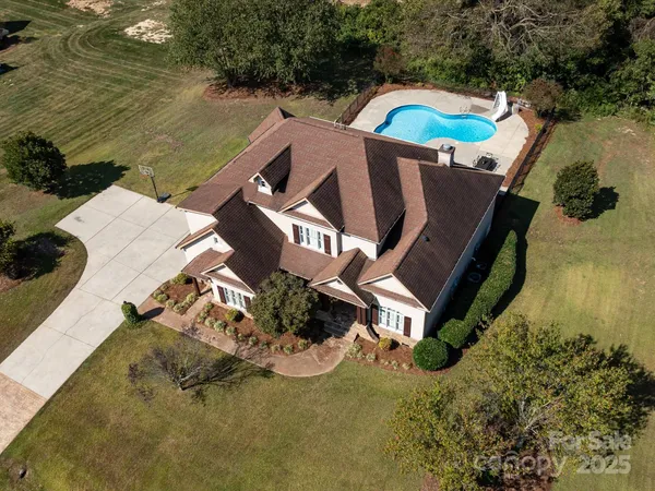 a view of a house with a swimming pool